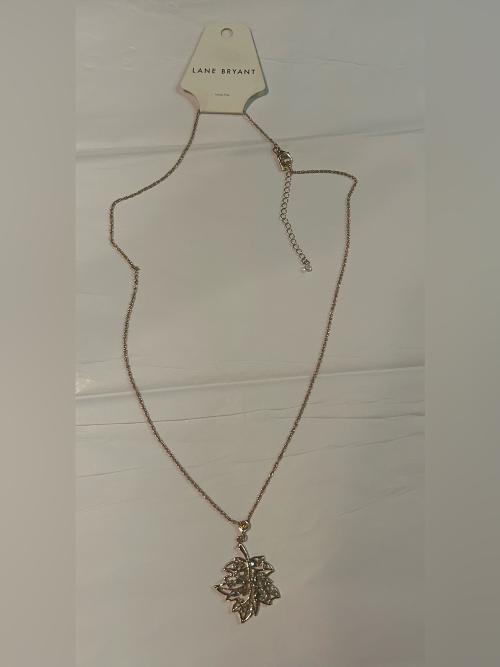 gold-tone Lane Bryant necklace , textured cutout leaf pend